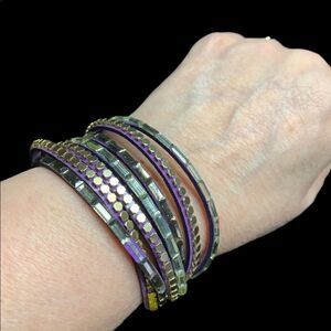 Leather and silver wrap bracelet. Goldtone snaps, purple leather.